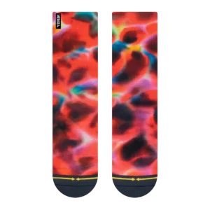 Close-up of red tie-dye fabric with a small black vertical label along the left edge.