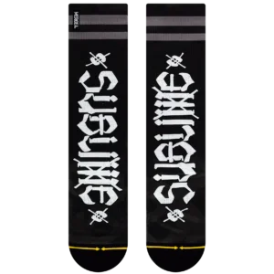 Pair of black socks with white vertical stylized characters, gray top stripes, and a small skull-and-crossbones motif near the ankle; yellow toe line at the bottom edge.