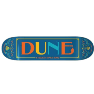Blue skateboard deck with ornate gold border and multicolor DUNE logo, and 'STEREO SINCE 1992' text along the bottom edge in orange.