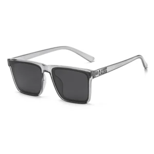 Clear-frame sunglasses with dark rectangular lenses, angled to show side logo on temple (brand: A Lost Cause).