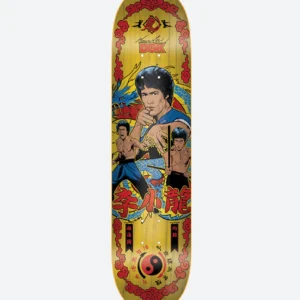 Skateboard deck with retro kung fu comic art: a central martial artist in blue, dragons, and red Chinese characters on a yellow wooden background, with a yin‑yang symbol at the bottom.