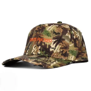 Camouflage baseball cap with orange stitched text reading 'SHITS FUCKED' on the front panel.