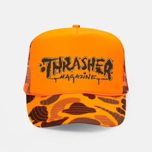 Orange trucker hat with Thrasher Magazine logo on the front and a camouflage brim/mesh sides for a bold streetwear look.