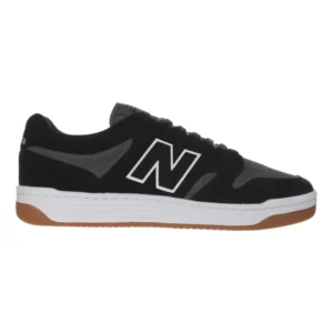 Black sneaker with a white 'N' logo on the side, white midsole, and gum-colored outsole (New Balance-style shoe).